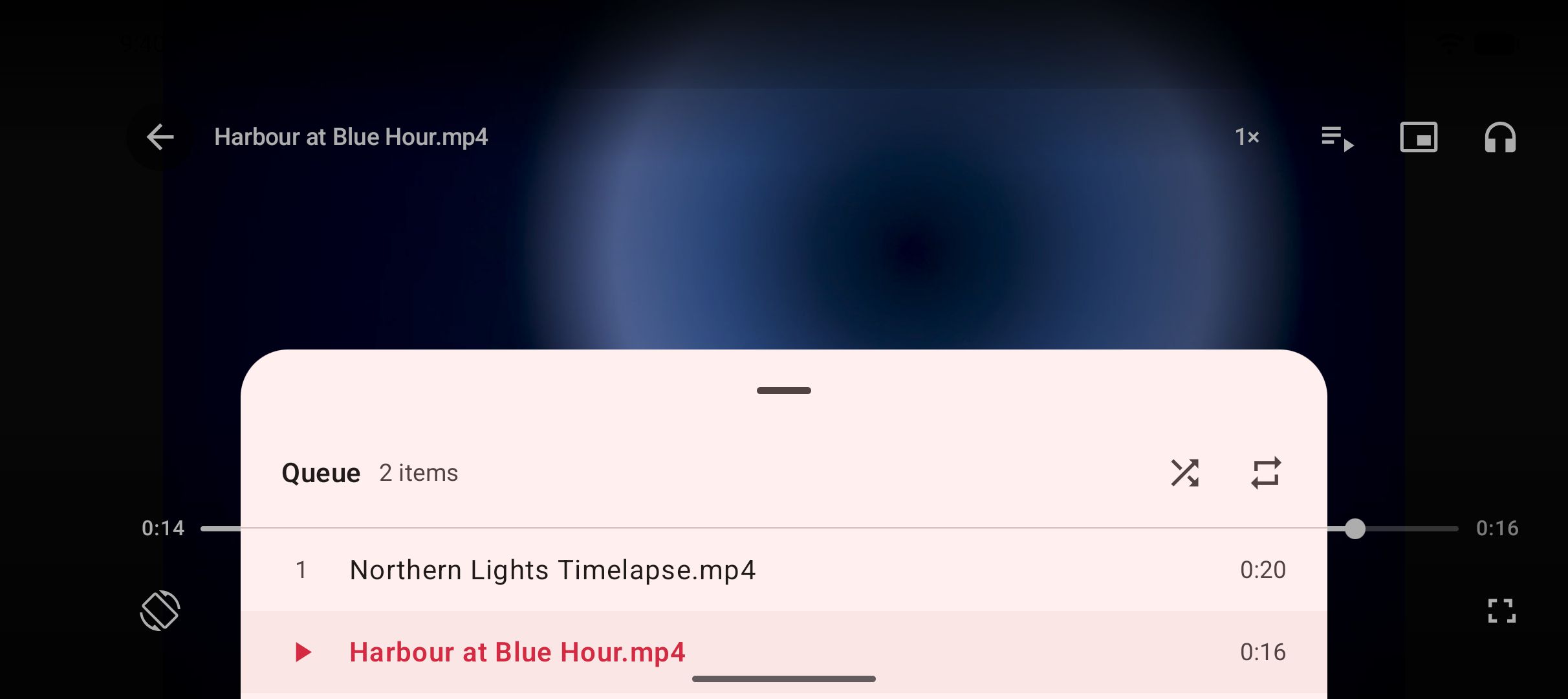 The video player with its queue open, listing the saved videos it can move between.