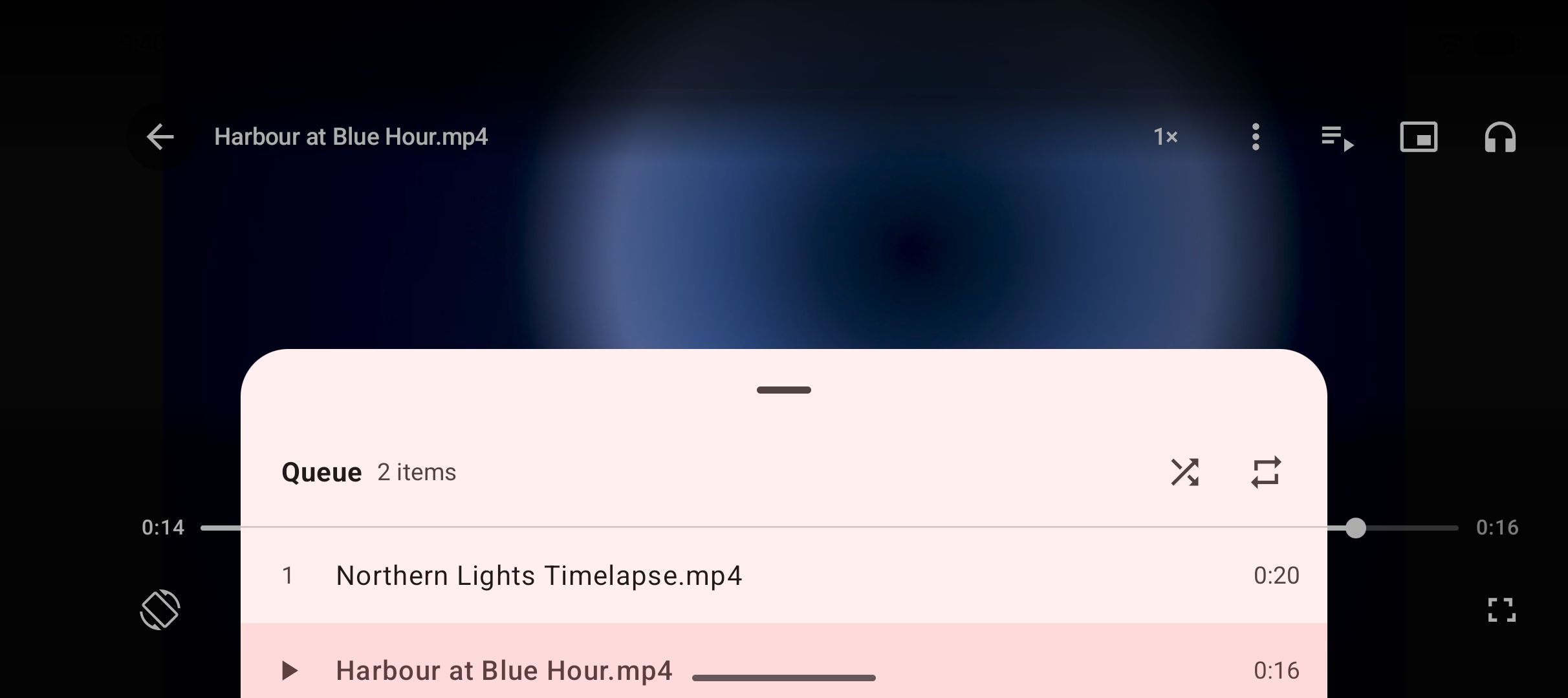 The video player with its queue open, listing the saved videos it can move between.